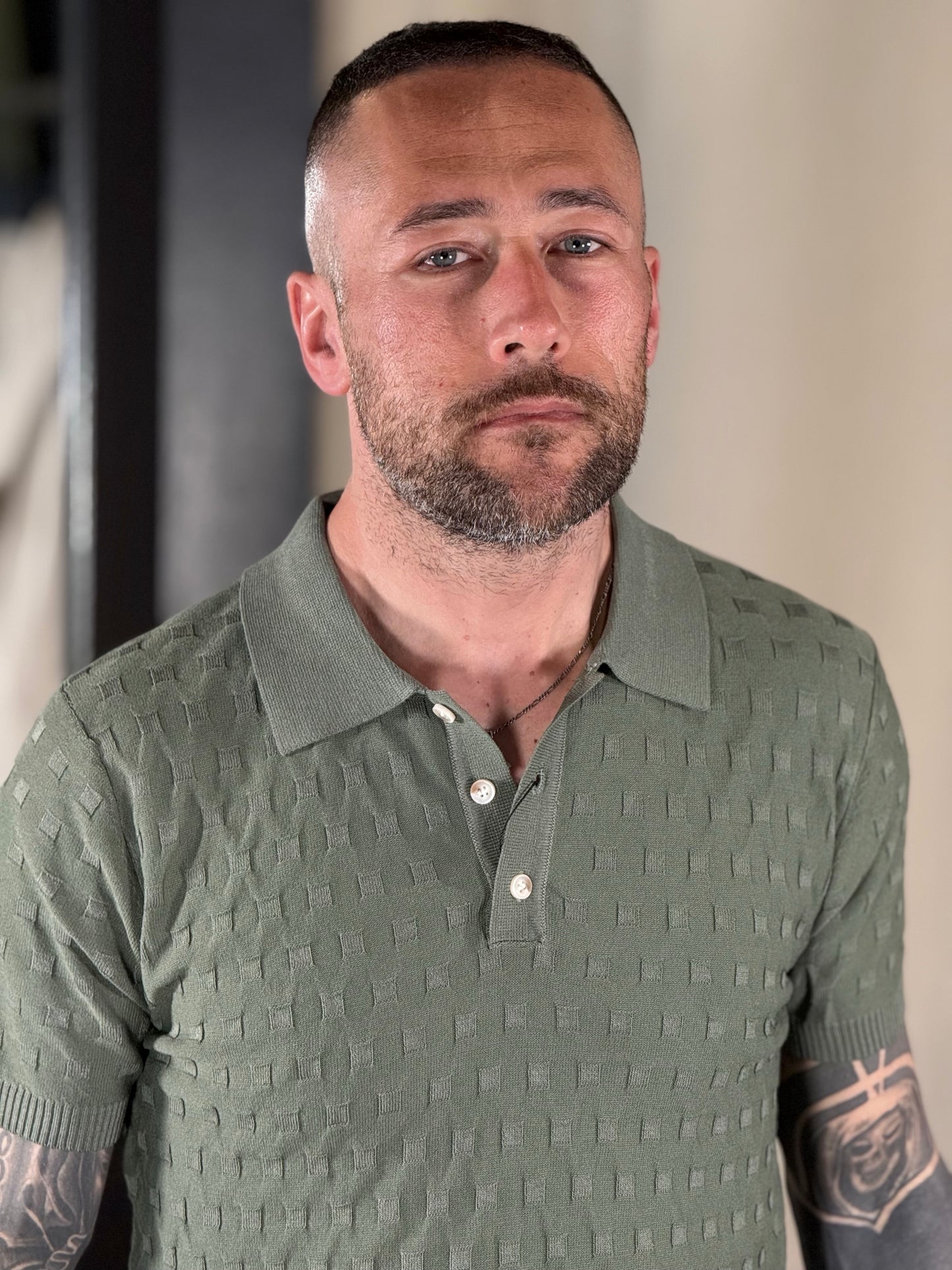 Polo in maglia verde con rombi tono su tono 181