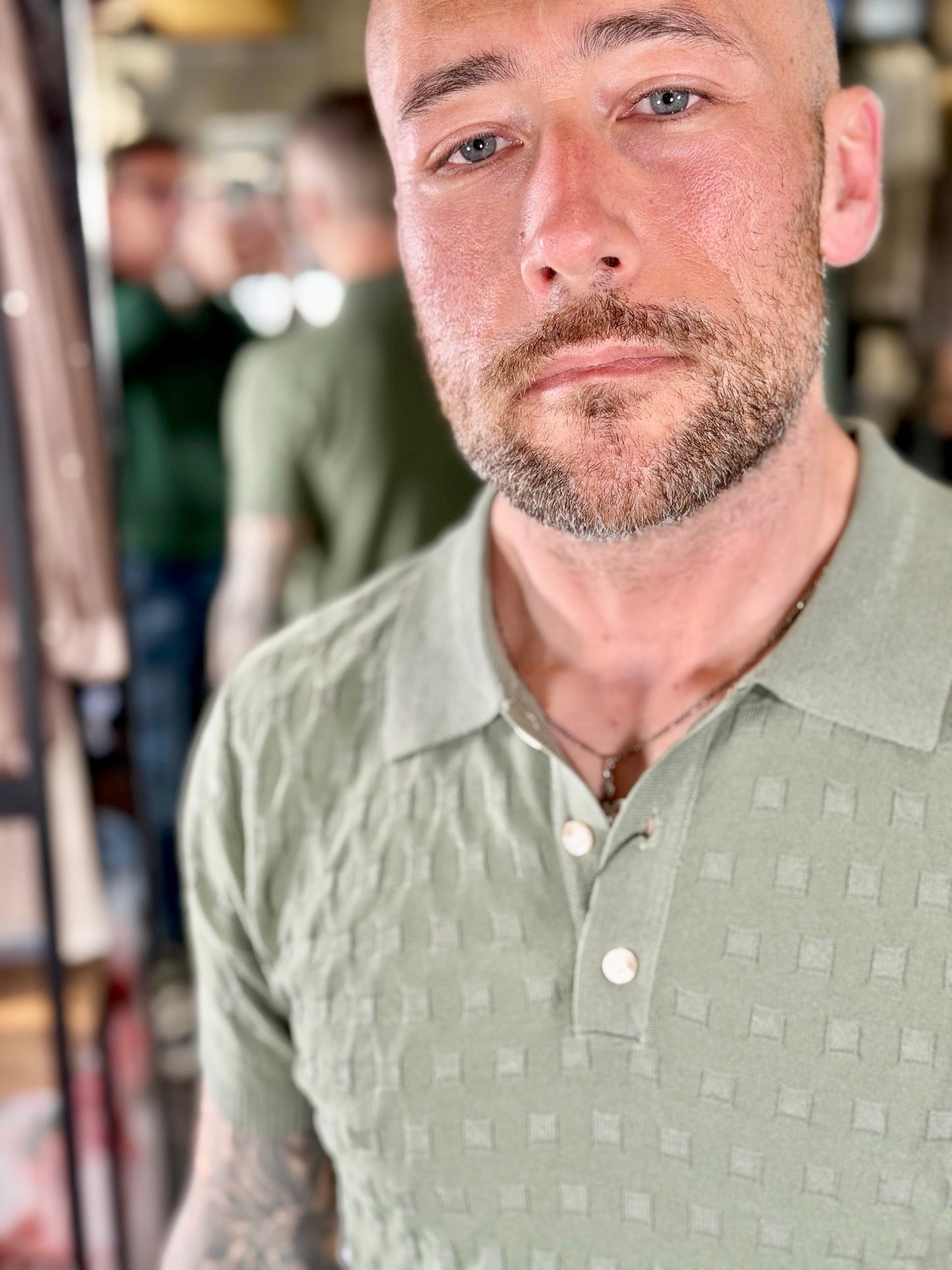 Polo in maglia verde con rombi tono su tono 181