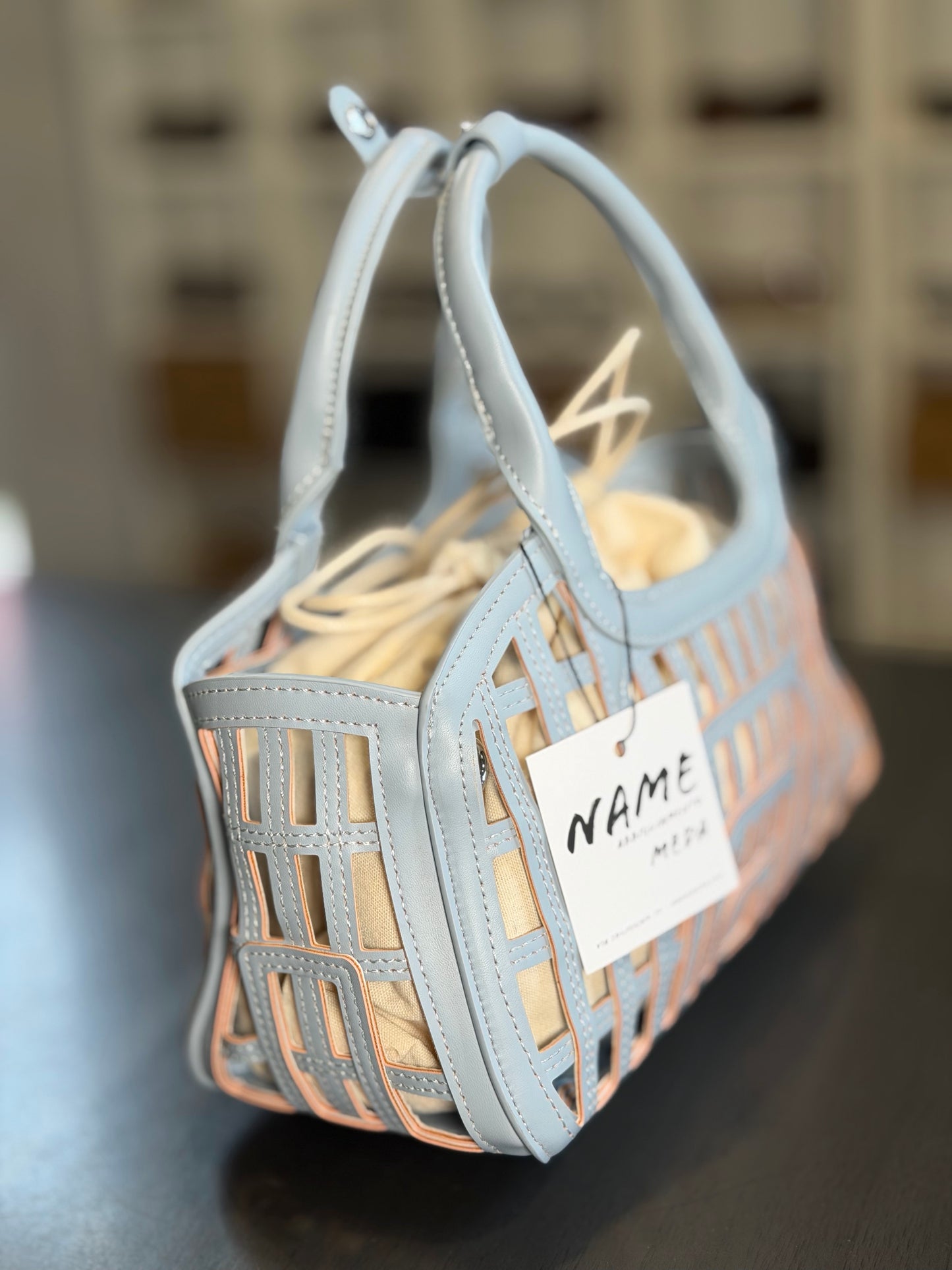 Mini bag traforata azzurra con sacca all’interno 2200