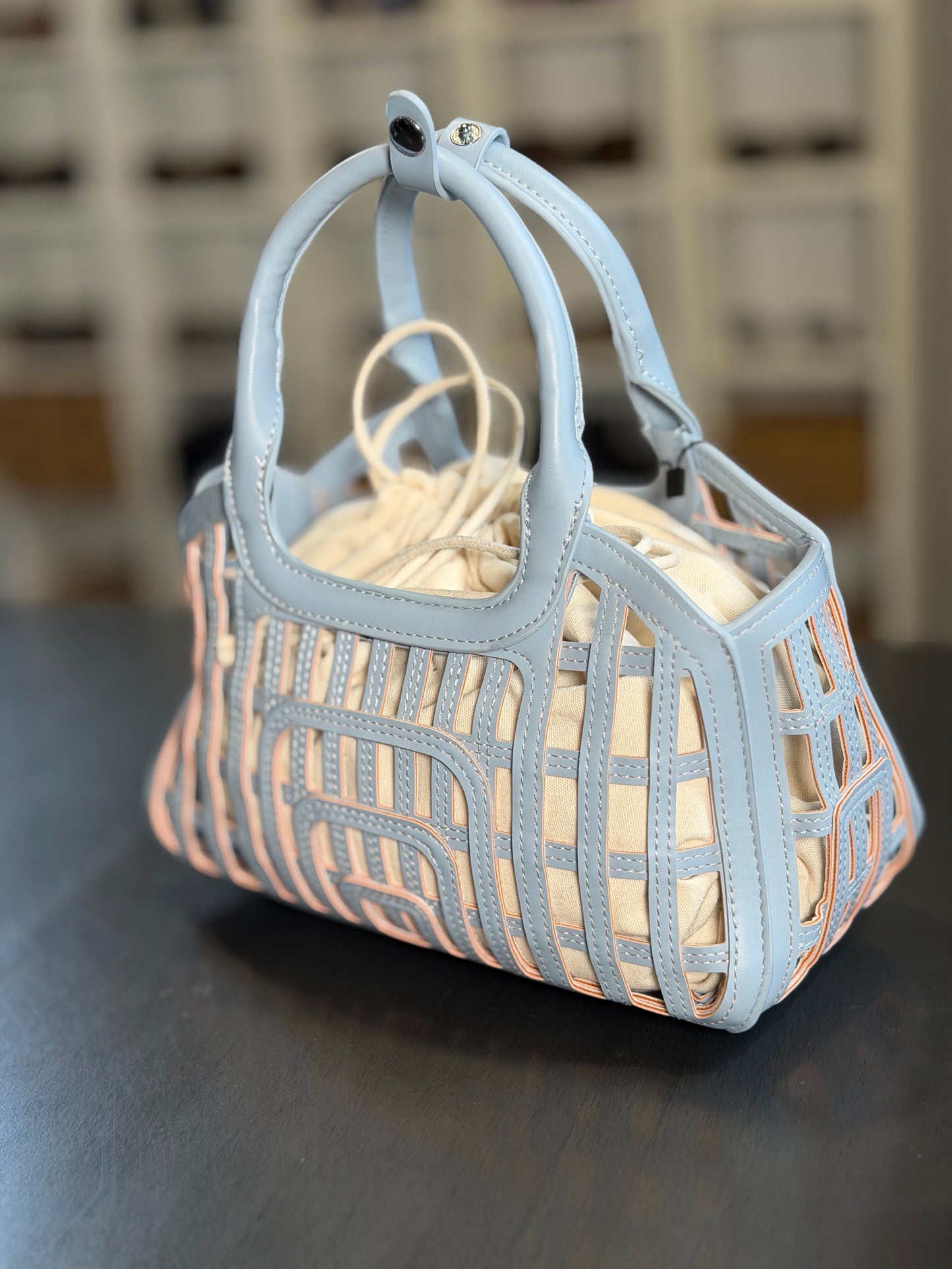 Mini bag traforata azzurra con sacca all’interno 2200